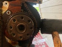 .....then take a rubber mallet and give the crankshaft a few whacks while you are trying to pull the chain off the crankshaft gear.  After a few whacks, I was able to break it loose.  

All of this can be avoided by waiting to remove the bearing brace/caps until AFTER this balance shaft chain is removed.  