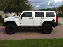Powder coated rims, side steps, and gas door. Line-ex'ed grill, door handles, and mirrors. 2" lift with Goodyear Dura-Tracs.  K&amp;N air filter, magna-flow exhaust, E3 spark plugs.