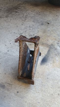 Whats left of our side steps. One bracket saved as a souvenir lol it was totally rusted out. It was a pain tonget these brackets out, 4 or 5 per side. 