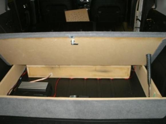 not pretty inside, but who's gonna see it? stores my emergency supplies and any contraband i want to carry;)
the whole thing is fastened to the 4 floor hooks. doesn't jump, shake or rattle.