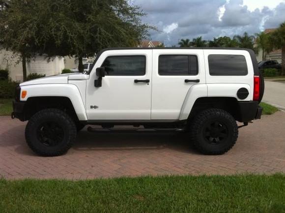Powder coated rims, side steps, and gas door. Line-ex'ed grill, door handles, and mirrors. 2" lift with Goodyear Dura-Tracs.  K&amp;N air filter, magna-flow exhaust, E3 spark plugs.
