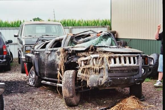 Rolled into a 14 foot deep ditch after the collision.