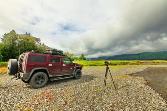 On the beach, photos of fishing trawlers near shore catching salmon