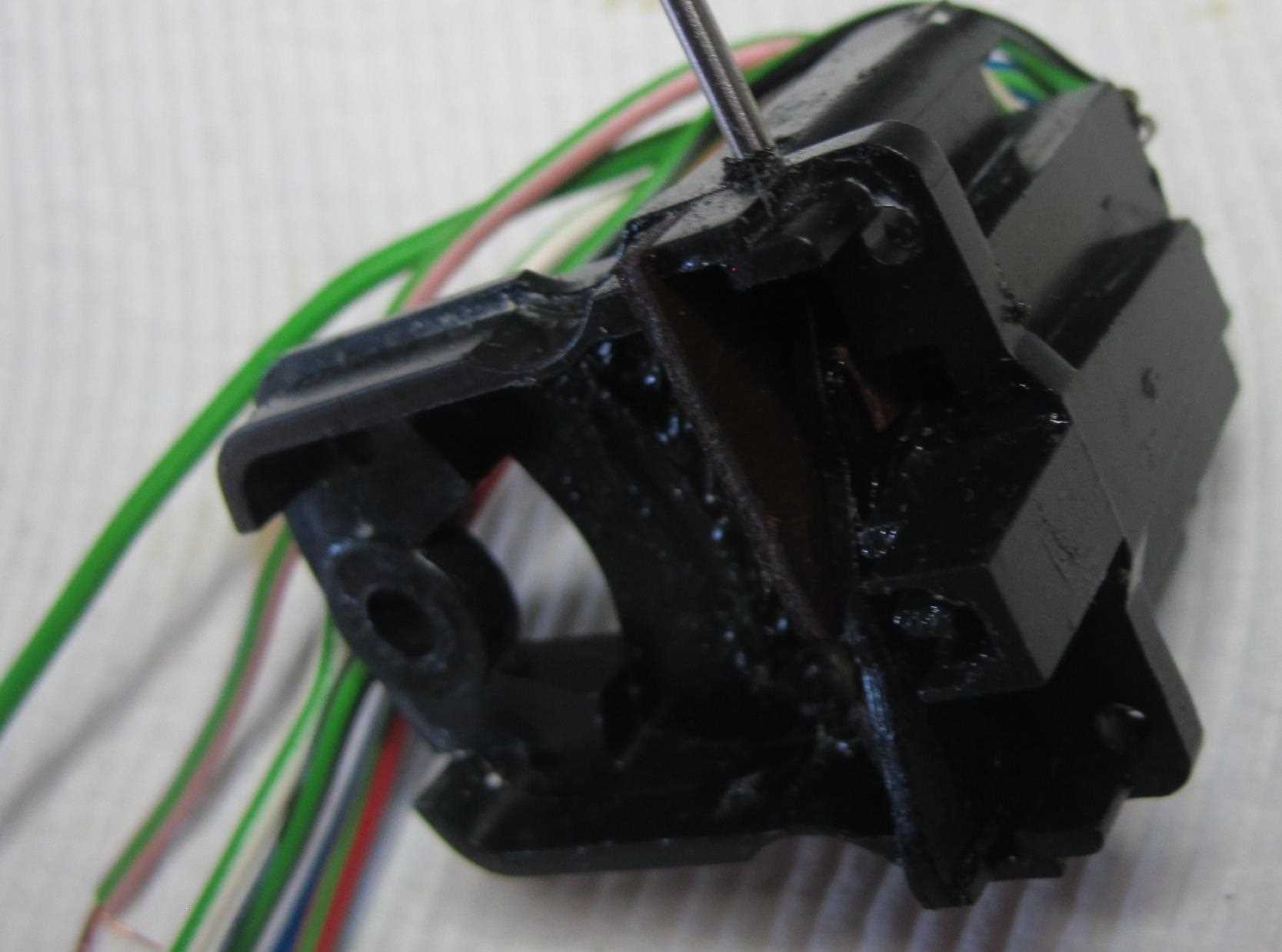 Cam held down with drill bit. Note notch position on adjacent piece