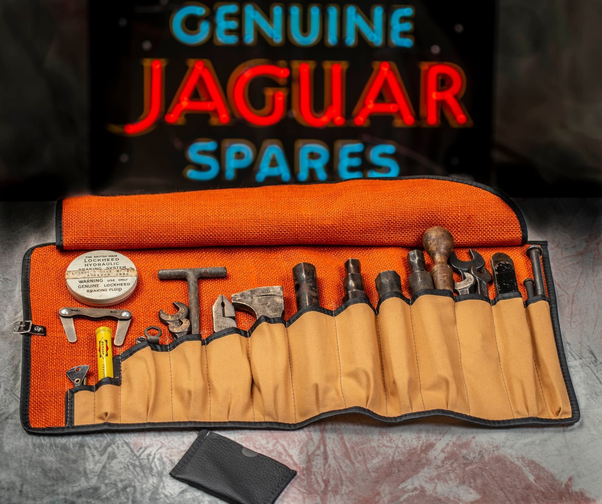 Here is a picture of the early XK120 in Tan Canvas and Red Burlap/Hessian with tools installed to show what the Roll would look like complete. I only supply the Tool Bags, but can assist you in finding the correct tools for your car.