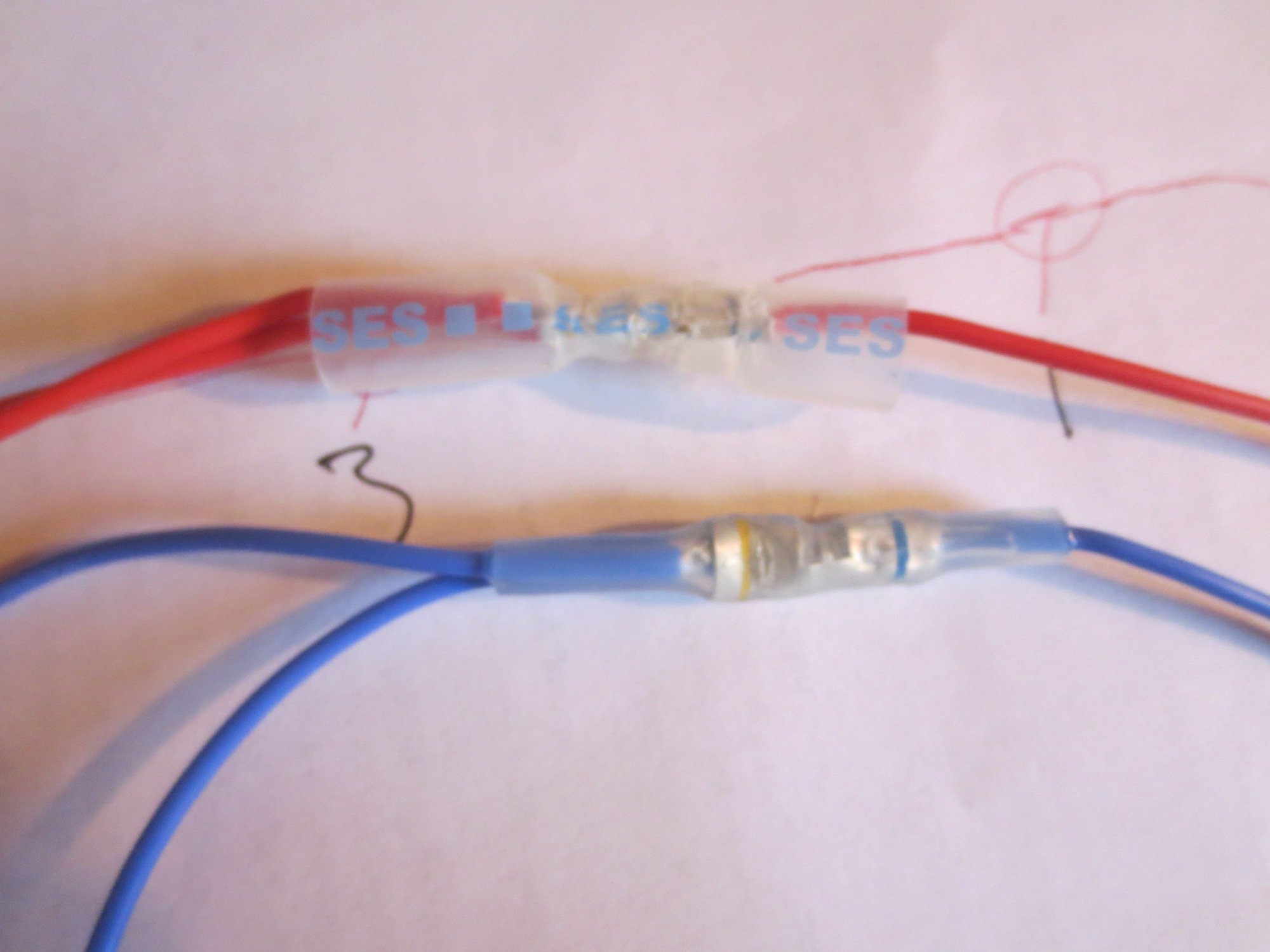 A bank odd numbered injectors loom contruction photo (red carries 12v, blue carries to earth as commanded by the ECU).The blue has been crimped and heat shrunk, the red has been crimped but not yet shrunk
