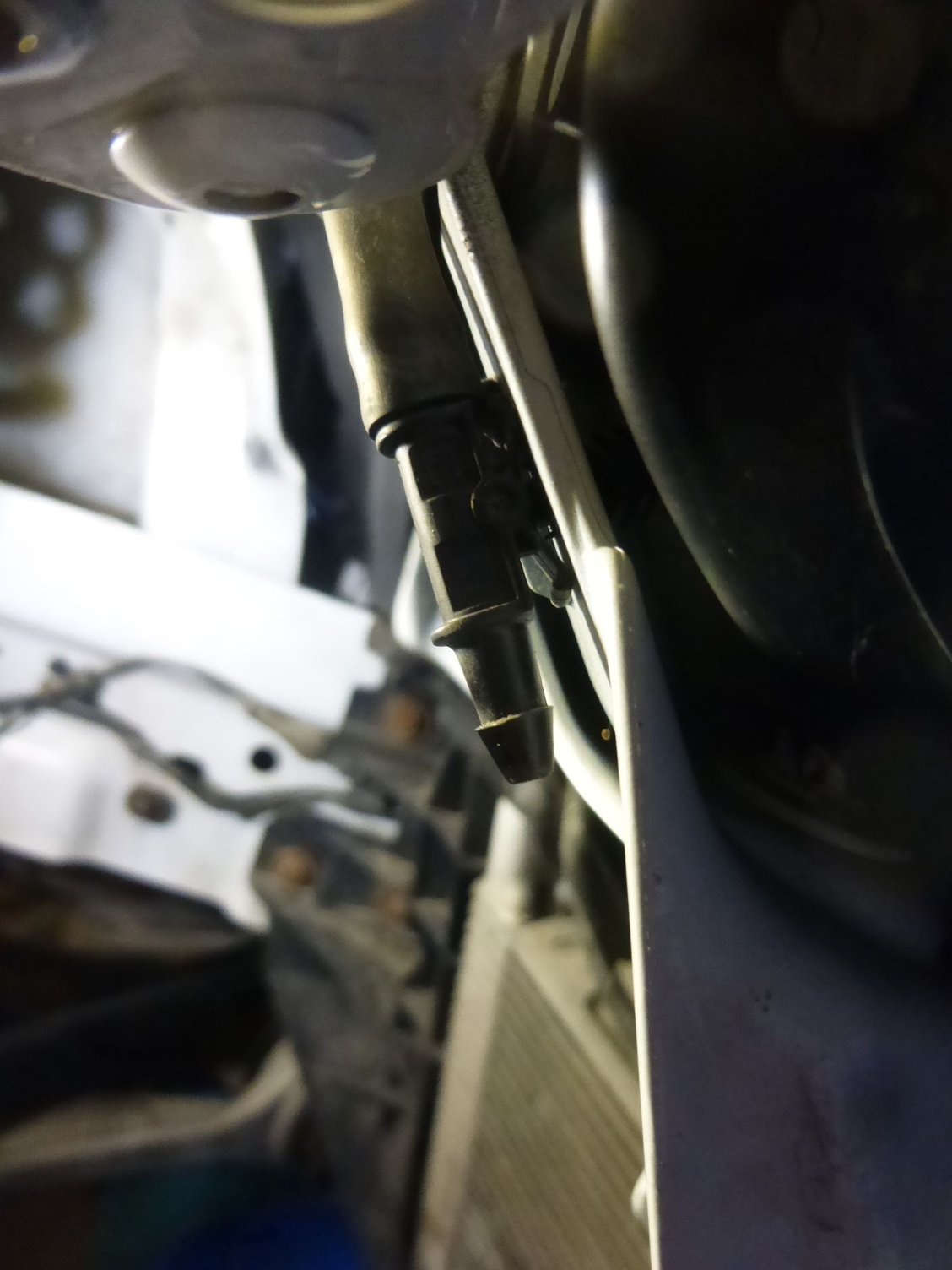 This is where you disconnect the headlamp washers water supply before dropping the bumper cover.