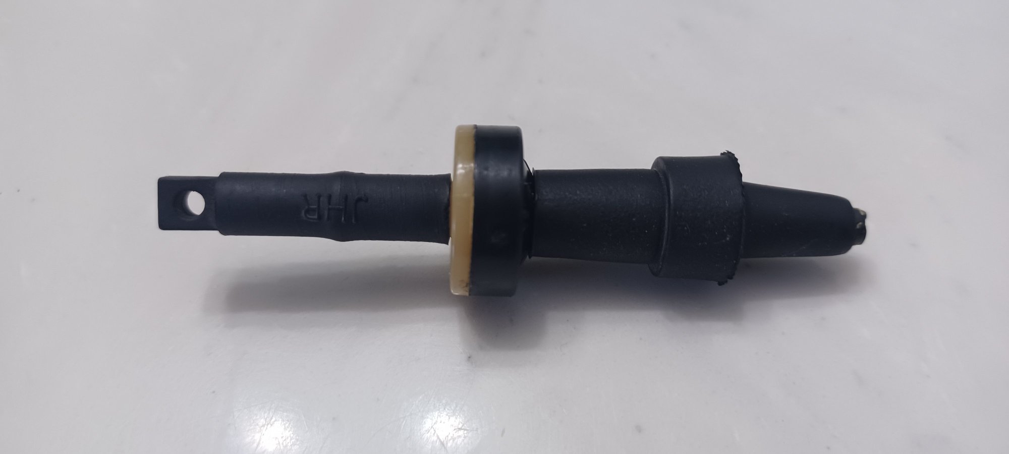 This is the one-way vacuum check valve assembly minus the clip that holds it to the intercooler crossover hose. The clip is not part of the vacuum line. The clip is zip-tied to the vacuum line to keep the check valve from flopping around.