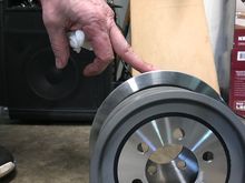 OEM aluminum pulley in foreground 2.75 lbs, new stainless 7.00 lb pulley behind