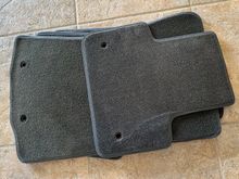 The mat on the top is Llyod's and the ones underneath are OEM.