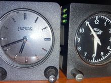 Early clock on the left. 
Later clock on the right. 
I know the 98’s had the early clock. I’m not sure when the later clocks were installed. My wife’s 00’ XJ8 has the later clock. So either the later clocks were in the 99’ MY or 00’ was the first year. 