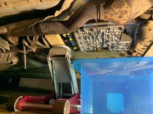 Sump off gearbox. Jack supporting box while you remove gearbox mount (left side of pic). When mount was removed it was fine to remove jack in my experience for rest of job - the gearbox hardly dropped at all.