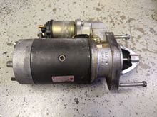 The top bolt by the solenoid is the one in question.