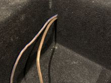 Routed the wiring through pre-existing hole in shell from elastic band. Then sealed the rest of the hole afterwards. Also needed to seal the other 3 holes I the shell from the other slots for the other inbuilt elastic bands