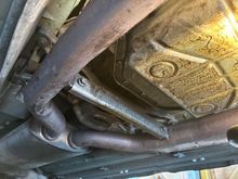 I'm thinking these 2 bolts have to come off to lower the exhaust pipes enough so the CAT can be dropped