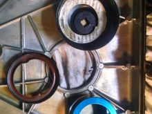 I removed the front crankshaft seal with one piece from the kit and I put an oil filter socket behind the timing cover, then tapped the seal out.   I will install the new seal prior to installing the timing cover.