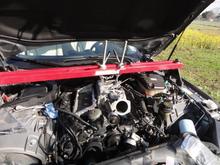 I followed the suggestion to use an engine support bar to lift the supercharger and intake manifolds.  It made the job MUCH easier. I used it again to suspend the supercharger while attaching the intake manifolds