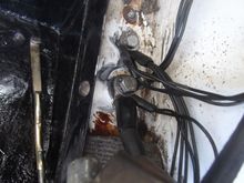 Earth connections from loom to the frame to the battery, and from the frame to the battery, including the main battery earth strap; cleaned to bright metal and attached.