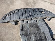 Both sections of the undertray removed.  Only the rear section needs to be removed to cut the hole.You can see the centerline fore and aft that you need to measure from