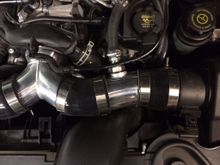 This is how I did the breather hose. I can't weld aluminum so I used a "silicone port system" and a very small amount of JB Weld on the inner flange and the outer nut assembly. The JB Weld is the heavy duty 550 degree stuff. I have used this same stuff on turbo blow off valve flanges that refused to seal.