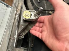 I loosened this bolt but did need remove it. Lifting up the linkage a little gets you just enough clearance. 