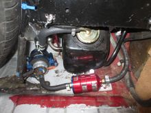 Sytec bullet filter after the pump. All gets covered by the OEM metal cover, but the pump and filter are much easier to access. It also removes about 6 feet of tubing from the OEM system.