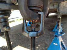 Best tool for removing vertical link to lower ball joint connection. You need to remove brake discs and dust shield though