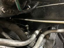 Showing the cable from the Car/Screen lever within the car to the lever attachment of the opening flap