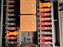 fuse box located in the engine bay 