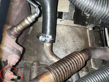 However, I'm can't get ANY purchase on this damn bolt on the other side of that flange to be able to remove the EGR pipe. Does anyone have any idea what tool and what angle would best help here. 

I have tried socket-wrenches, spanners, off-set spanners, and none seem to work for me. Either they collide with the damn pipe and cannot grip the bolt, or I cannot apply any torque to the tool if it's somehow able to grip the bolt. 