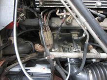 The shiny new metal cable is the new throttle cable.
