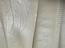 SLIGHT WEAR ON SEAT BACK AT SEAM