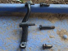 I know the Ball Joint goes in the bottom hole of this Steering Arm but I've got a bit lost after that.