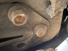 This looks like  a small headache. Driver's side subframe bracket bolt was ground down by the road back when the suspension collapsed a couple years ago. 