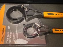 A pair of Strap Wrenches for removing Oil Filters and Breaking the Seal when removing the bottom Radiator Hose