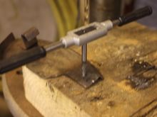 Tapping the hole to replace the broken thread