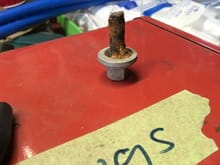 Bolt found on the floor, appears to be snapped in half.