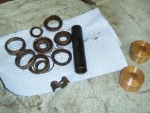 All that crud on the left... replaced with the two brass bushings on the right. Oh man, so much easier to deal with.