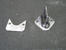 Now that the trunk had hinges and a strut to hold it up, it needed a latch.  Not wanting to invent everything on this car, i cheated and raided the corvette parts bin for a late model electric latch assembly.  unfortunately, the "latch" part could in no way be mounted to the underside of the trunk lid.  that started another little "diversion"...  here is the factory trunk latch with the "adapter plate" i cut out of 16 gage steel.