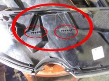 Underside of a headlamp showing the washer retaining