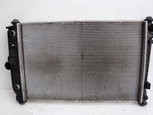 Aston Martin OE Radiator (Plastic End Tanks): 

Engine side
Ebay: $496.00 USD ($789 AUD)