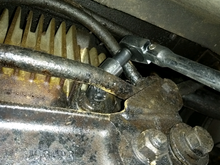 Using a u joint to free the differential oil fitting