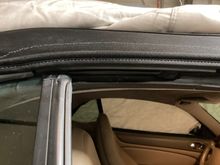 Visible just under the lip and stitching for the top. Zoom in for better view.