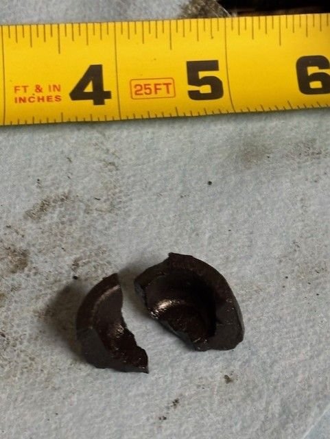 These pieces appear to form part of a larger one that may be circular in diametre. I believe it is hardened rubber but I can't be 100% sure. Engine ran fine during a brief trial.