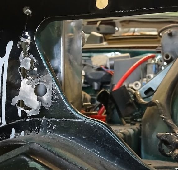 I remember now what that other hole is, and it will need to be changed a little, it is the mounting hole for the headlight frame. I may be able to get away with cutting the bolt a bit shorter as a nut is all that goes on the other side.