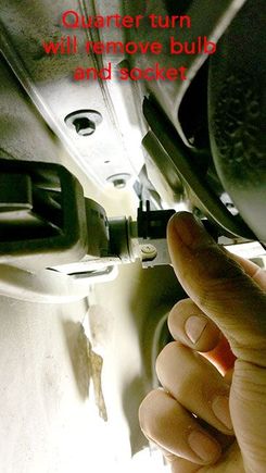 No need to remove metal retaining clip - twist a quarter turn to remove the bulb with socket.