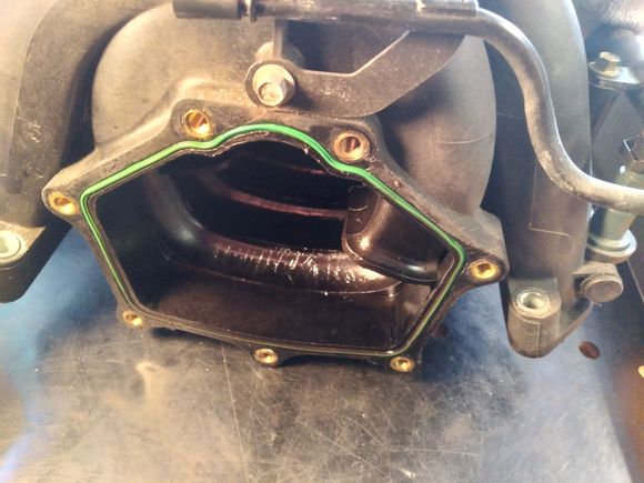 Back side of the intake manifold.  The 90 degree elbow bolts up to this and the throttle body sits on top of the elbow.