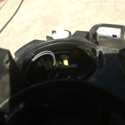 Best inside view I could get of high beam adjuster screw.  