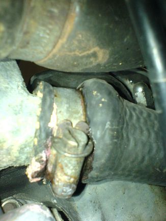 Water pump bypass hose entering water inlet pipe