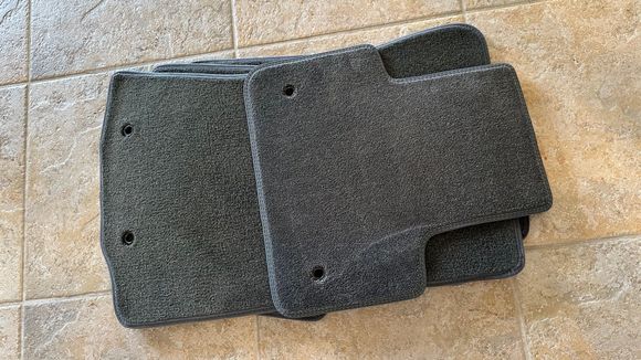 The mat on the top is Llyod's and the ones underneath are OEM.